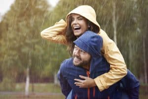 man and woman, smiling in rain, rain from heaven, heavenly rain, deuteronomy