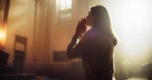 trusting God, woman praying to God in a church, beautiful church prayer