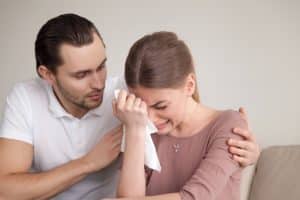 the power of Gods word, woman crying, husband or boyfriend comforting her