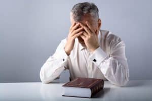 Christian man not feeling good enough, shame, fear, doubt, praying, Bible, desperate